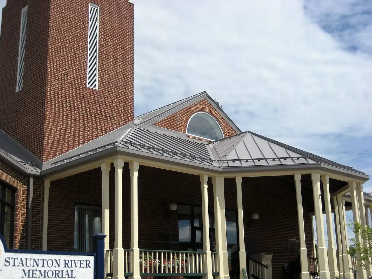 Skilled roofing craftsmen working on a residential roof in Martinsville
